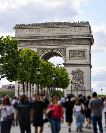 Arc de Triomphe with blurred crowd and trees in Paris, Franceの写真素材