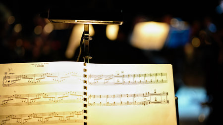 Musical score with clip light and bokeh background at orchestra rehearsalの写真素材