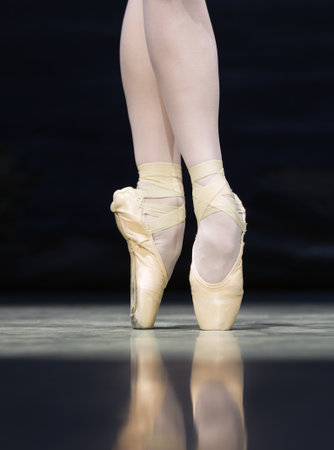 Close-up of ballet dancers legs in pointe shoes