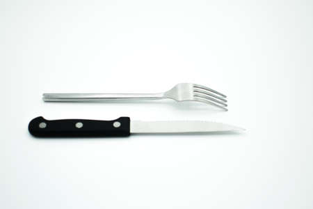 stainless fork and knife on gray backgroundのeditorial素材
