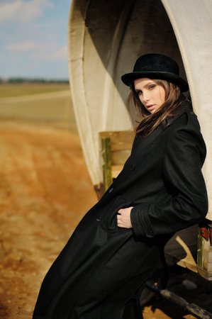 portrait of a beautiful girl in a hat with straight lookの写真素材