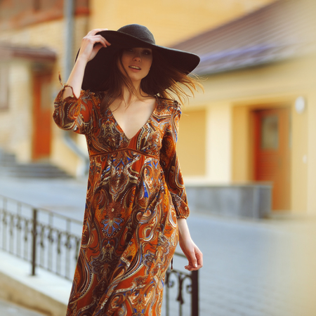 Portrait of girl in hat in motionの写真素材