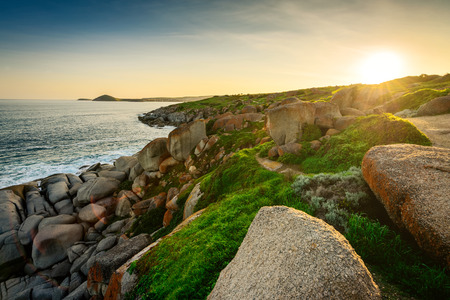 Sunset above the island in the middle of the seaの写真素材