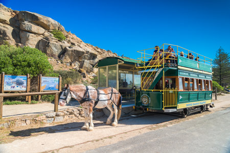 Victor Harbor South Australia  April 4 2015: People are riding the Horse Drawn Tram heading to the Granite Island. Granite Island attracts many tourists all year around.のeditorial素材
