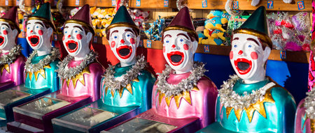 Victor Harbor, South Australia - April 4, 2015: Happy clowns and other toys standing on the shelves...