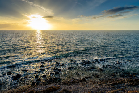 Dramatic sunset over the sea. Marino Rocks beach, South Australiaの写真素材