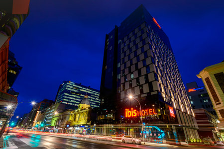 Adelaide, South Australia - August 11, 2015: Ibis Hotel on Grenfell street with traffic at night. Photo taken in long exposure mode.のeditorial素材
