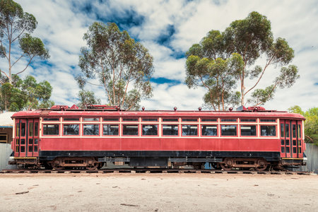 Old abandoned rusty tram on railsの写真素材