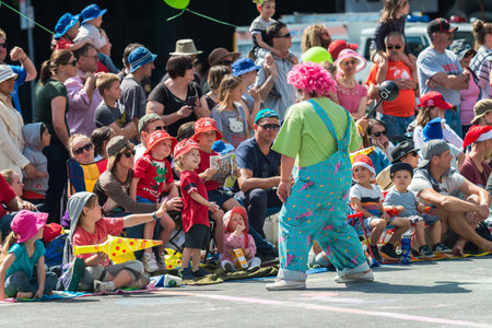 Adelaide, South Australia - November 14, 2015: Clown interacting with kids at Christmas Pageant. Christmas Pageant is a community event with fantasy and fairy floats, colourful characters, clowns, bands, dancers and more!のeditorial素材
