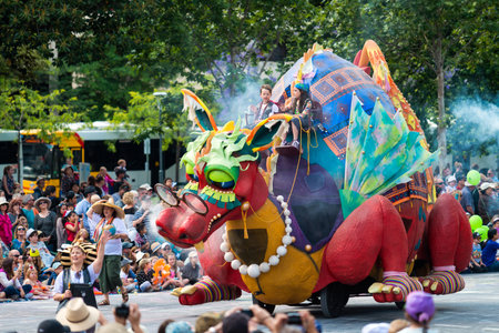 Adelaide, South Australia - November 14, 2015: Kids riding Flights of Fancy with Granny Flo character during Credit Union Christmas Pageant event. Christmas Pageant is a community event with fantasy and fairy floats, colourful characters, clowns, bands, dのeditorial素材