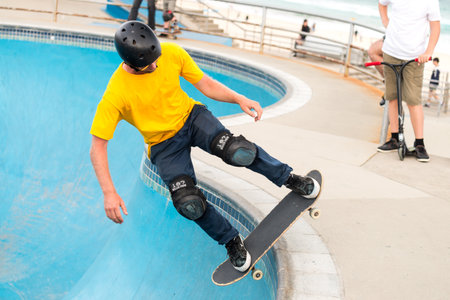 Sydney, Australia - November 8, 2015: Unknown skateboarder is doing skating tricks at Bondi Skate Park. Bondi Beach Skate Park is a new well constructed skate park with one of the best vert bowls in he country and amazing views over Bondi Beach.のeditorial素材