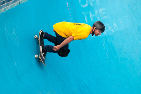 Sydney, Australia - November 8, 2015: Unknown skateboarder is doing skating tricks at Bondi Skate Park. Bondi Beach Skate Park is a new well constructed skate park with one of the best vert bowls in he country and amazing views over Bondi Beach.のeditorial素材