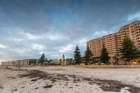 Adelaide, Australia - August 10, 2013: View at Glenelg beach hotels with Town Hall on Moseley Square at duskのeditorial素材