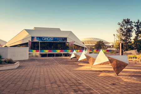 Adelaide, Australia - January 3, 2016: Adelaide Festival Centre with Adelaide Oval Stadium on the background near the Elder Park during summer time. Color-toning effect appliedのeditorial素材