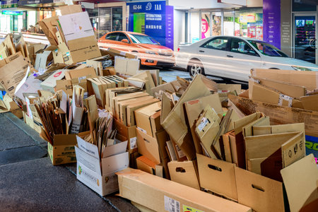 Adelaide, South Australia - August 11, 2015: Recyclable waste collection day in Adelaide city. Night view of the street with paper boxesのeditorial素材