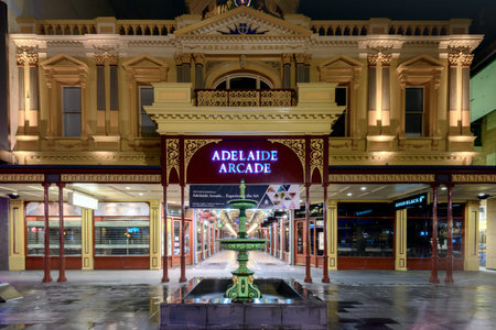 Adelaide, Australia - August 11, 2015: Adelaide's famous Rundle Mall Arcade Building at night time under the rain during winter seasonのeditorial素材