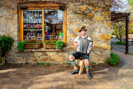 Hahndorf, Australia - August 13, 2016: Man playing  accordion on the street near German Village Shop in Hahndorf, Adelaide Hills area, South Australia.のeditorial素材