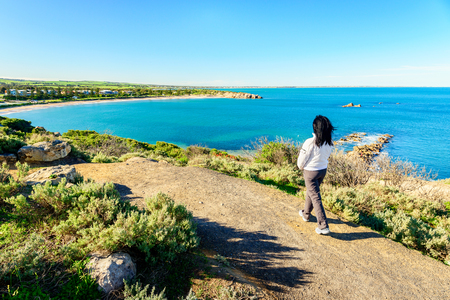 Woman walking along the heritage trail at Port Elliot, Horseshoe Bay, South Australia,の写真素材