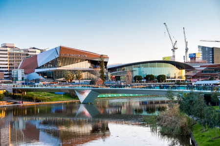 Adelaide, Australia - September 11, 2016: People walking through Torrens foot bridge from Adelaide Oval after game in Adelaide city centre at sunsetのeditorial素材