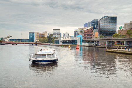 Melbourne, Australia - December 27, 2016: People traveling on Melbourne River Cruises boat along the Yarra river,  Victoriaのeditorial素材