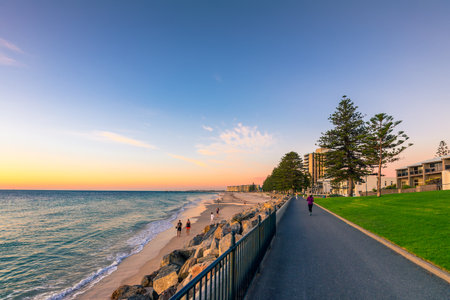 Adelaide, Australia - February 11, 2016: People walking along Esplanade at  Glenelg Beach. Esplanade is a very popular place among locals and touristsのeditorial素材
