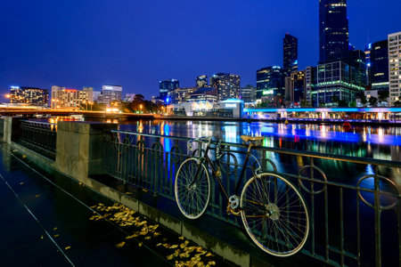 Melbourne, Australia - December 27, 2016: Vintage style bicycle  parked in Melbourne CBD near the Yarra river at nightのeditorial素材
