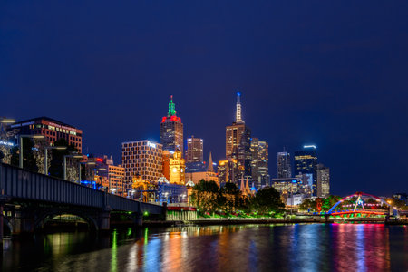 Melbourne, Australia - December 27, 2016: Melbourne city illuminated skyscrapers at night viewed across the Yarra riverのeditorial素材