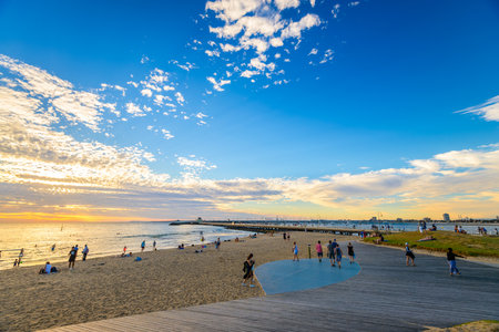 Melbourne, Australia - December 28, 2016: People spending time on St. Kilda Beach at sunset on a hot summer day, Victoria, Australiaのeditorial素材