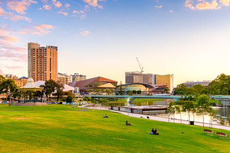 Adelaide, Australia - April 5, 2017: Adelaide city skyline with Torrens river foot bridge at sunset viewed from King William street towards west.のeditorial素材