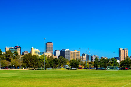 Adelaide, Australia - April 14, 2017: Adelaide city skyline view across northern parklands on a bright dayのeditorial素材