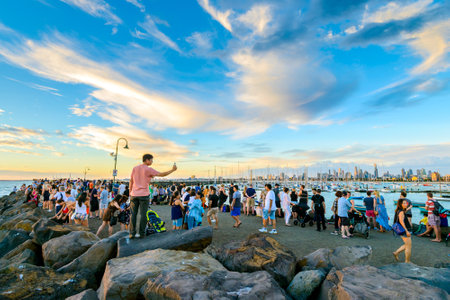 Melbourne, Australia - December 28, 2016: Crowd of people gathered at St Kilda breakwater to watch penguins after sunset on a warm summer eveningのeditorial素材