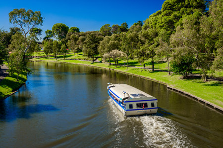 Adelaide, Australia - April 14, 2017: Iconic Pop-Eye boat  traveling upstream  Torrens river in Adelaide CBD on a bright dayのeditorial素材