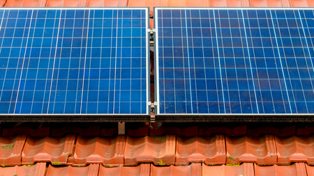 Dirty solar panels on the house roof inMelbourne suburbs, Victoria, Australiaの写真素材