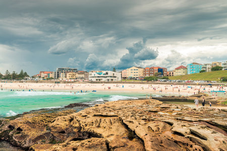 Sydney, Australia - November 6, 2015: People having fun at Bondi Beach on a day before stormのeditorial素材