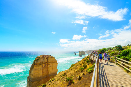 Port Campbell, Victoria, Australia - December  30, 2016: People walking along the Castle Rock pathway and enjoyong the view of Twelve Apostles on a bright dayのeditorial素材