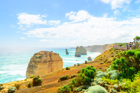 Port Campbell, Victoria, Australia - December  30, 2016: People walking along the Castle Rock pathway and enjoyong the view of Twelve Apostles on a bright dayのeditorial素材