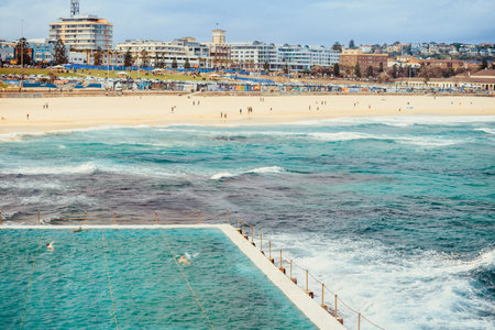 Sydney, Australia - November 8, 2015: Bondi Beach skyline view with people having fun viewed across swimming pool on a dayのeditorial素材