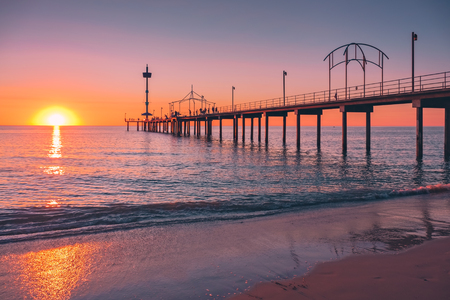Brighton Beach pier with people at sunset, South Australiaの写真素材