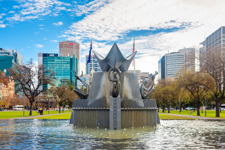 Adelaide, Australia - June 28, 2017: Victoria Square fountain viewed from South to North with buildings and traffic at morning timeのeditorial素材