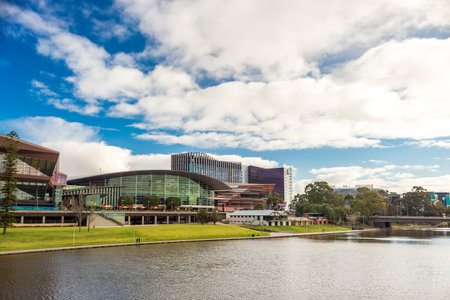 Adelaide, Australia - August 27, 2017: Adelaide city view across Torrens river from footbridge  during winter timeのeditorial素材