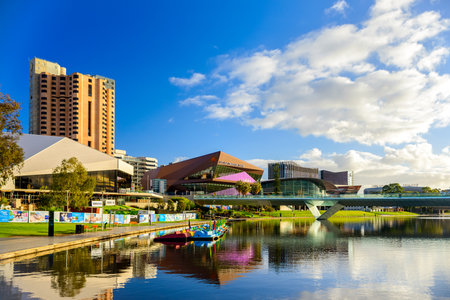Adelaide,  Australia - August 27, 2017: Adelaide city skyline viewed across Torrens river in Elder Park on a bright dayのeditorial素材