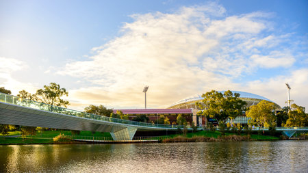 Adelaide, Australia - August 27, 2017: Adelaide Oval viewed across Torrens river in Elder Park at sunsetのeditorial素材
