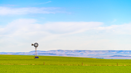 Old windmill connected to sloar batteries in rural South Australia near Snowtownの写真素材