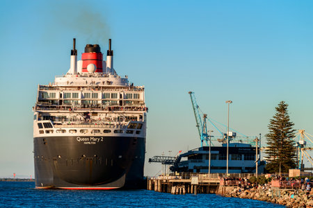 Adelaide, Australia - February 16, 2018: Cunard Line RMS Queen Mary 2 with people on board ready for departure for a cruise from Outer Harbour in Port Adelaideのeditorial素材
