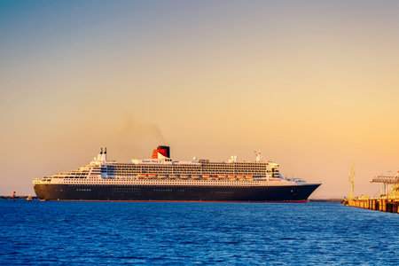 Adelaide, Australia - February 16, 2018: Cunard Line RMS Queen Mary 2 with people on board departing for a cruise from Outer Harbour, Port Adelaideのeditorial素材