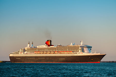 Adelaide, Australia - February 16, 2018: Cunard Line RMS Queen Mary 2 with people on board departing...