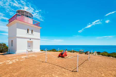 Kangaroo Island, South Australia - January 15, 2019: Iconic square shaped Cape Borda Lighthouse with cannon viewed towards the ocean on a bright dayのeditorial素材