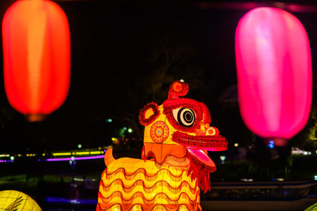 Adelaide, Australia - October 19, 2019: Lucky dog giant lantern carried through crowd of people  during Moon Lantern Festival celebration in Elder Park at nightのeditorial素材