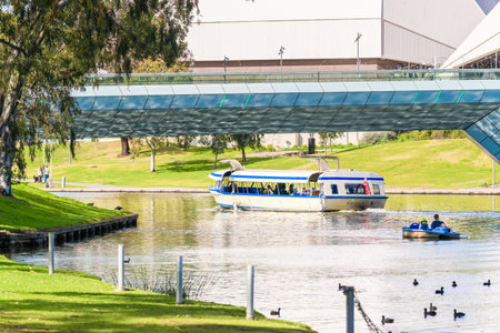 Adelaide, Australia - August 4, 2019: Iconic Pop Eye boat with people on board sailing along Torrens river in Adelaide city centre on a dayのeditorial素材