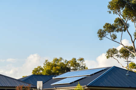 New solar panels installed on metal sheet roof of the house in South Australiaの写真素材